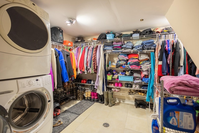 31124 Geraldine St, Westland, MI 48185 - washroom featuring stacked washer and clothes dryer and tile patterned floors