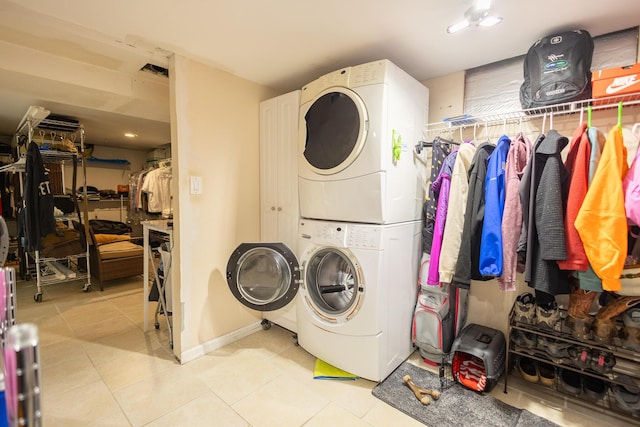 31124 Geraldine St, Westland, MI 48185 - laundry room with stacked washing machine and dryer and light tile patterned flooring