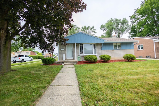 31124 Geraldine St, Westland, MI 48185 - view of front of house with brick siding and a front lawn