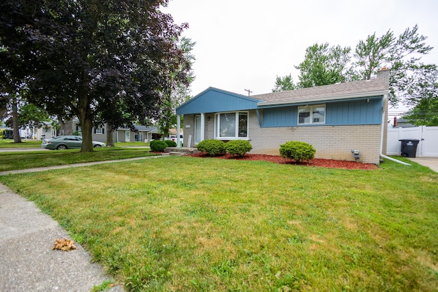 31124 Geraldine St, Westland, MI 48185 - view of front facade with brick siding and a chimney