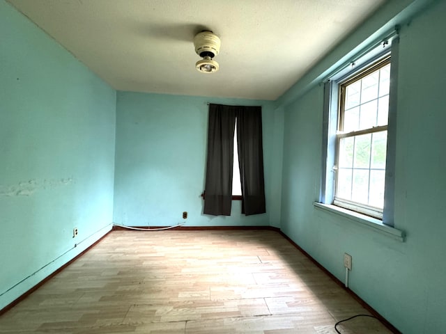 521 N 3rd St, Niles, MI 49120 - spare room featuring plenty of natural light and wood finished floors