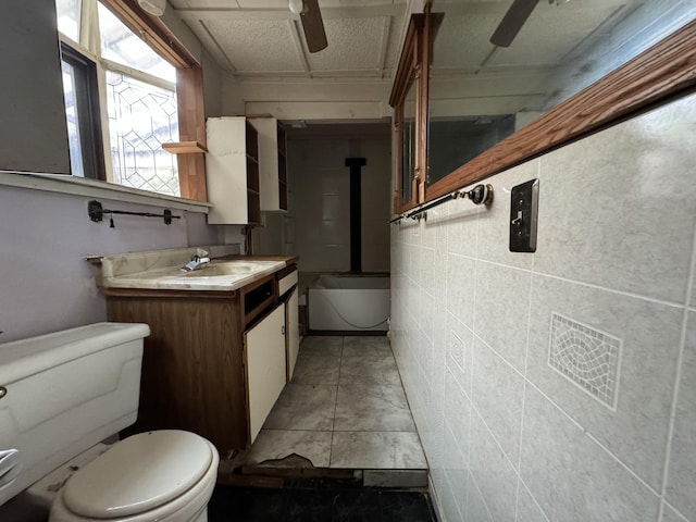 521 N 3rd St, Niles, MI 49120 - bathroom with vanity, ceiling fan, and shower / washtub combination