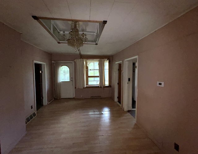 521 N 3rd St, Niles, MI 49120 - foyer with a chandelier and light wood-style floors
