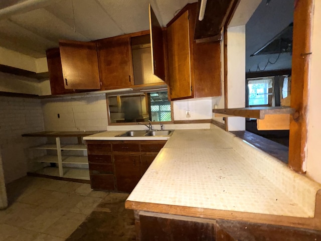 521 N 3rd St, Niles, MI 49120 - kitchen with light countertops, brown cabinets, and decorative backsplash