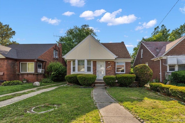 18285 Faust Ave, Detroit, MI 48219 - bungalow-style house featuring a front yard, brick siding, and cooling unit