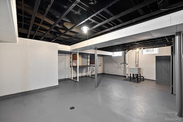 18285 Faust Ave, Detroit, MI 48219 - basement with a sink and baseboards