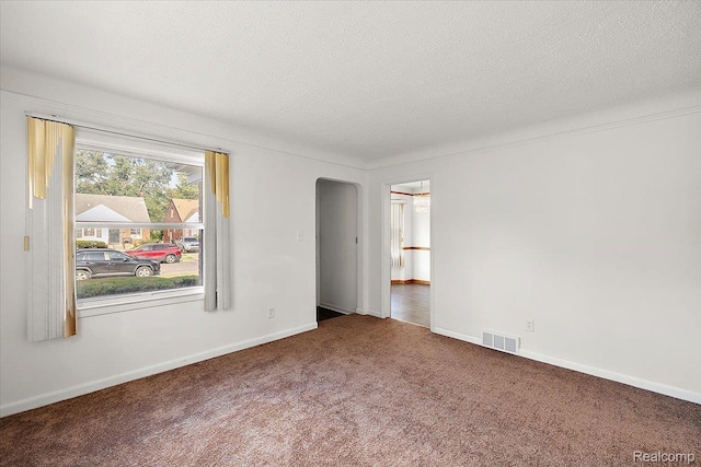 18285 Faust Ave, Detroit, MI 48219 - carpeted spare room with arched walkways and a textured ceiling