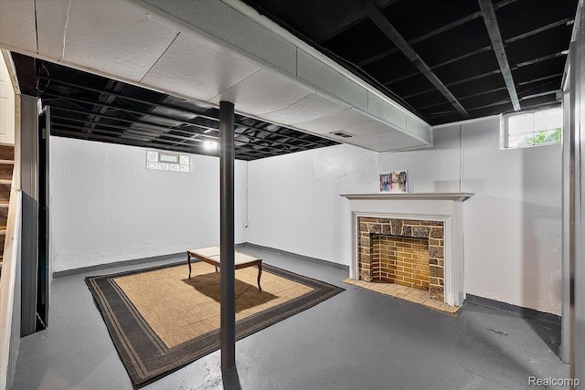 18285 Faust Ave, Detroit, MI 48219 - basement featuring a stone fireplace and baseboards