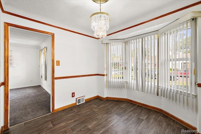 18285 Faust Ave, Detroit, MI 48219 - spare room with dark wood finished floors, a chandelier, a textured ceiling, and ornamental molding