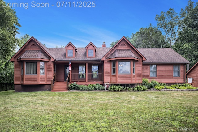 161OXBOW Oxbow Lake Rd, White Lake, MI 48386 - view of front facade with a chimney, roof with shingles, a porch, and a front yard