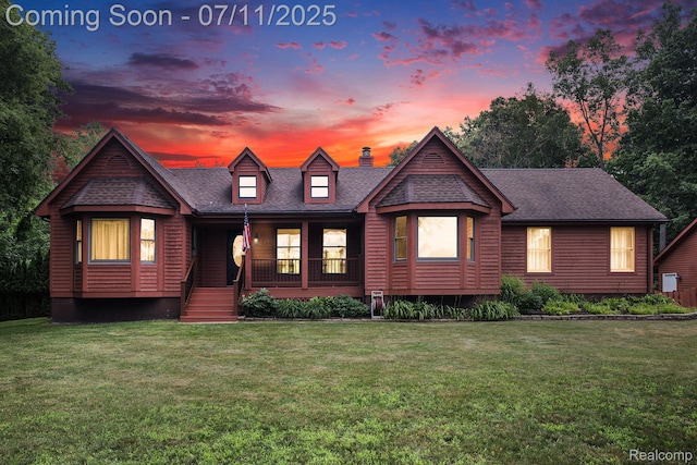 161OXBOW Oxbow Lake Rd, White Lake, MI 48386 - view of front of house featuring a chimney, covered porch, a front yard, and a shingled roof