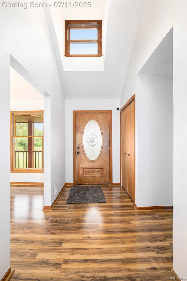 161OXBOW Oxbow Lake Rd, White Lake, MI 48386 - entrance foyer with high vaulted ceiling and wood finished floors