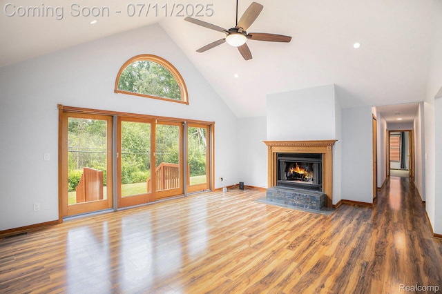 161OXBOW Oxbow Lake Rd, White Lake, MI 48386 - unfurnished living room with high vaulted ceiling, a glass covered fireplace, wood finished floors, a ceiling fan, and recessed lighting