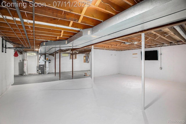 161OXBOW Oxbow Lake Rd, White Lake, MI 48386 - unfinished below grade area featuring heating unit and gas water heater