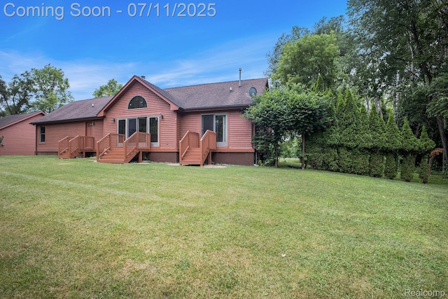 161OXBOW Oxbow Lake Rd, White Lake, MI 48386 - rear view of property featuring a lawn, roof with shingles, and a deck