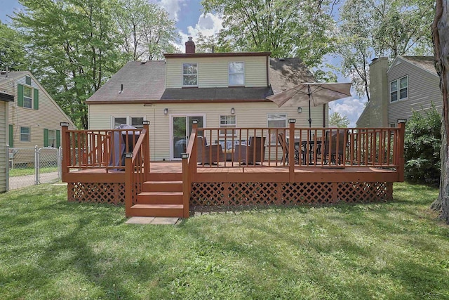 514 Hunter St, Saginaw, MI 48602 - back of property featuring a deck and a chimney