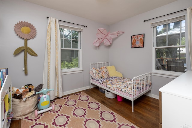 514 Hunter St, Saginaw, MI 48602 - bedroom featuring wood finished floors and baseboards
