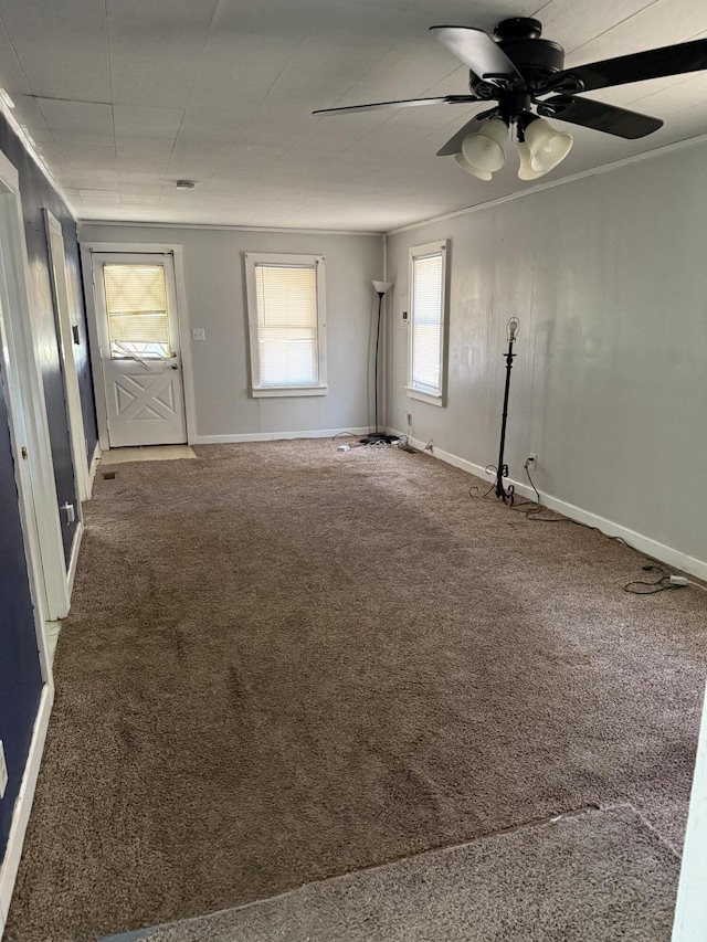2754 Huizenga St, Norton Shores, MI 49444 - carpeted spare room featuring ceiling fan and ornamental molding