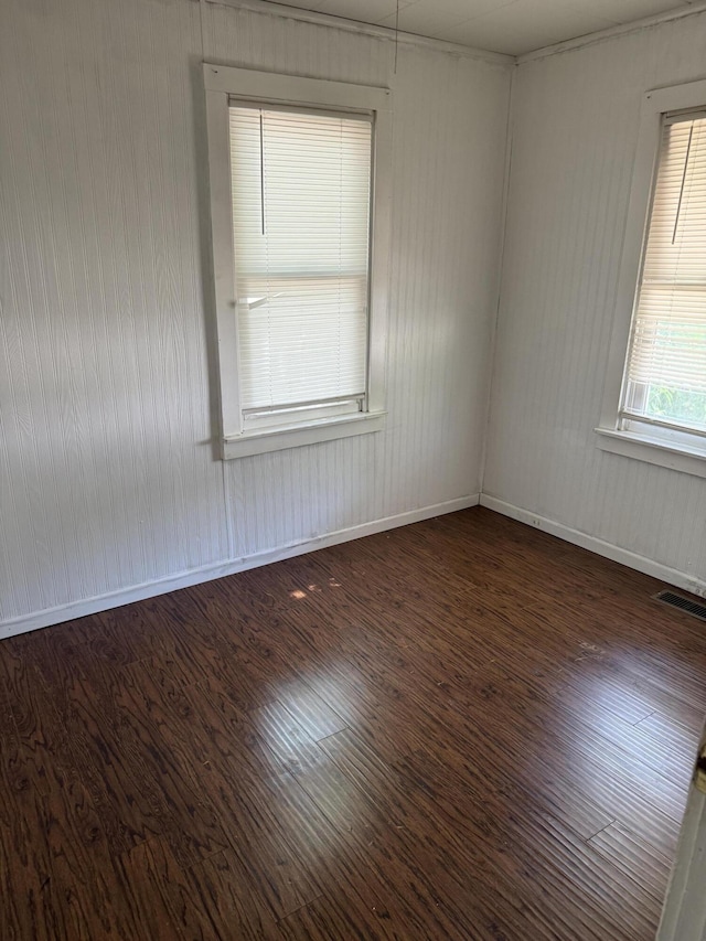 2754 Huizenga St, Norton Shores, MI 49444 - unfurnished room featuring wood finished floors and baseboards