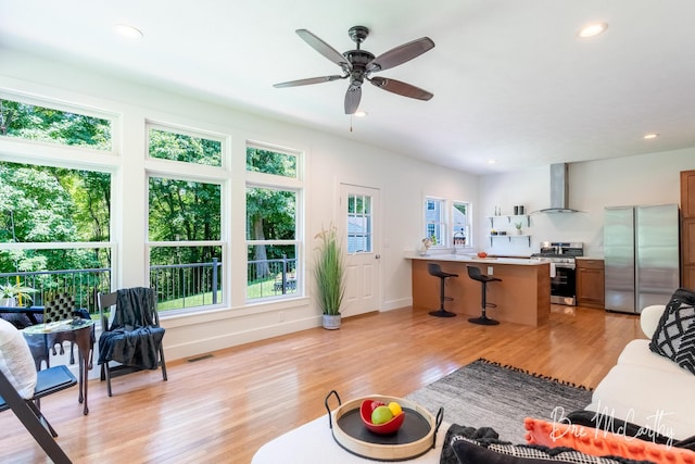 68 E River Rd, Muskegon, MI 49445 - living room with light wood-style floors, ceiling fan, and recessed lighting