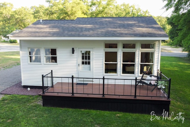 68 E River Rd, Muskegon, MI 49445 - back of house with a yard and a deck