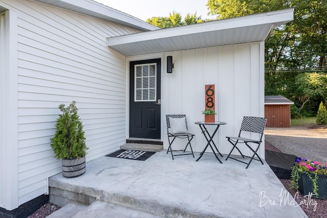 68 E River Rd, Muskegon, MI 49445 - view of exterior entry featuring board and batten siding