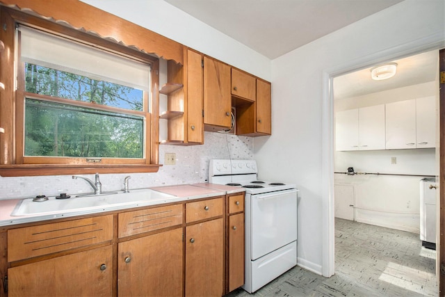 157 Elvern Dr, Coloma, MI 49038 - kitchen featuring electric stove, decorative backsplash, light countertops, and light floors