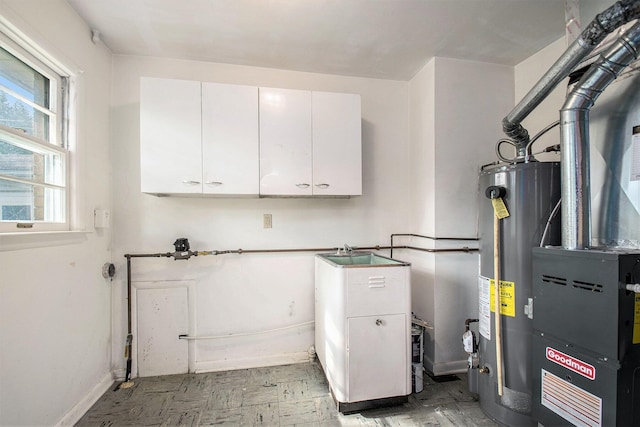 157 Elvern Dr, Coloma, MI 49038 - laundry area with gas water heater, cabinet space, light floors, and heating unit