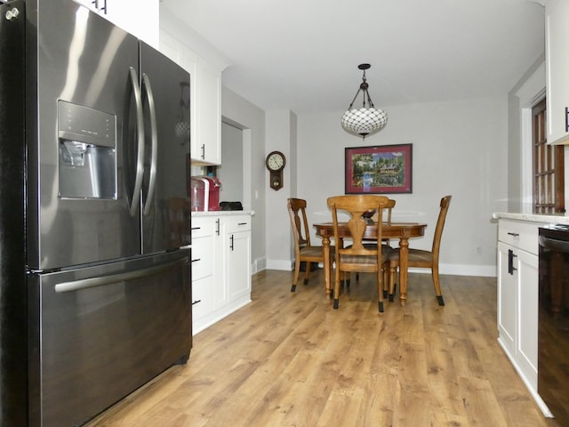 630 Forest St, Wyandotte, MI 48192 - dining room featuring baseboards and light wood finished floors