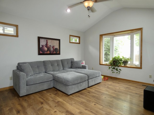 630 Forest St, Wyandotte, MI 48192 - living area with vaulted ceiling, a ceiling fan, and wood finished floors