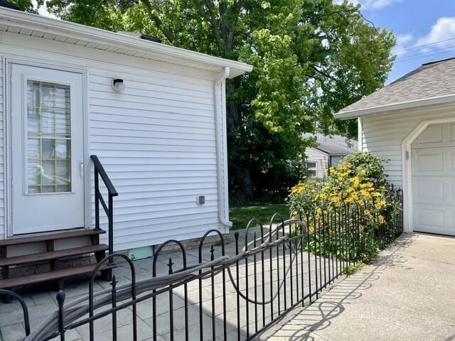 630 Forest St, Wyandotte, MI 48192 - view of patio / terrace with entry steps and a garage