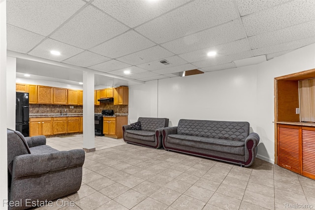 1625 Ferney St, Dearborn Heights, MI 48120 - living room with light tile patterned floors, recessed lighting, and a drop ceiling
