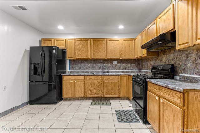 1625 Ferney St, Dearborn Heights, MI 48120 - kitchen with black appliances, under cabinet range hood, light tile patterned floors, decorative backsplash, and dark countertops