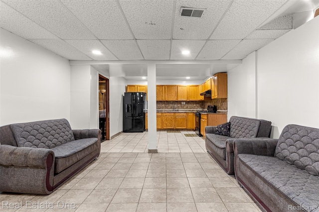 1625 Ferney St, Dearborn Heights, MI 48120 - living area with recessed lighting, light tile patterned floors, and a paneled ceiling