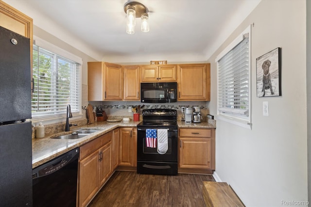 15404 Belmont Ave, Allen Park, MI 48101 - kitchen featuring black appliances, decorative backsplash, dark wood finished floors, and light stone counters