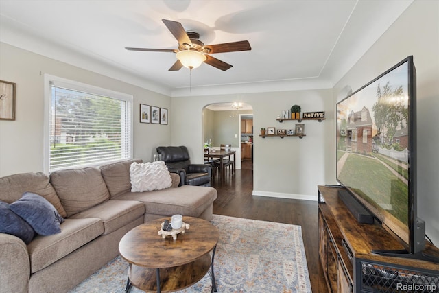 15404 Belmont Ave, Allen Park, MI 48101 - living area with arched walkways, dark wood-type flooring, and a ceiling fan