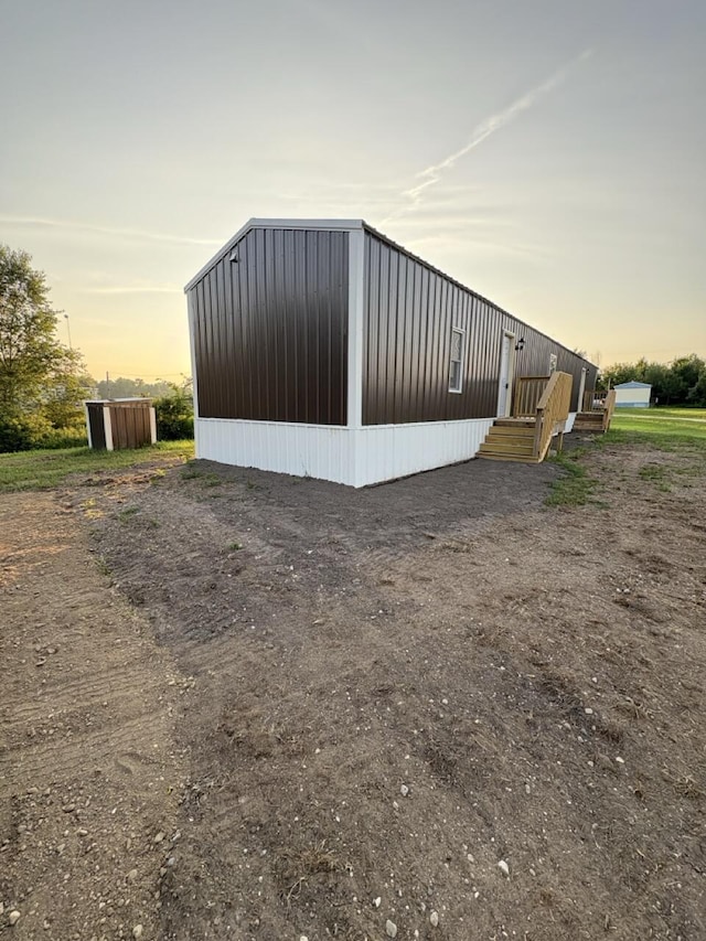 2835 E Sessions Rd, Sheridan, MI 48884 - view of property exterior at dusk