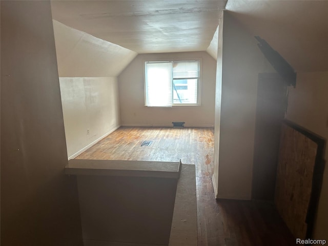 15921 Bramell St, Detroit, MI 48223 - additional living space with wood-type flooring and vaulted ceiling