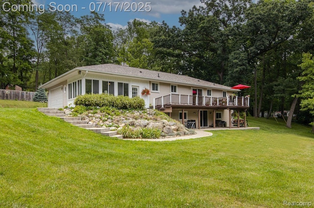 5074 Perryville Rd, Holly, MI 48442 - back of house featuring a wooden deck, a garage, and a patio area