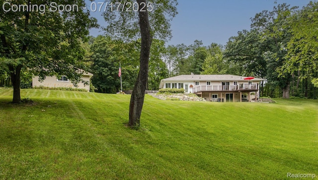 5074 Perryville Rd, Holly, MI 48442 - view of grassy yard with a deck
