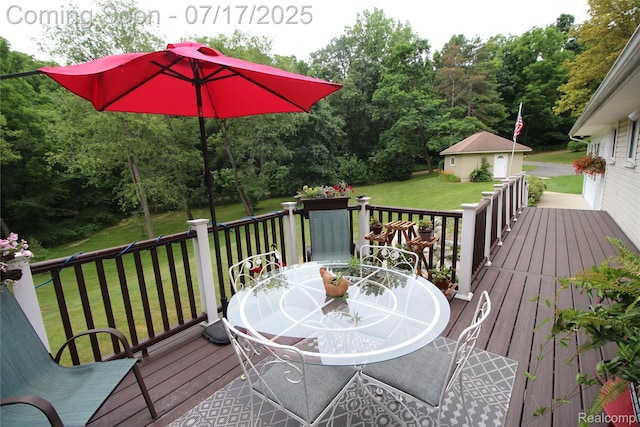 5074 Perryville Rd, Holly, MI 48442 - deck with a yard, outdoor dining area, and an outdoor structure