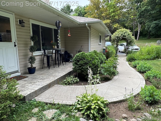 5074 Perryville Rd, Holly, MI 48442 - view of side of home featuring a patio area