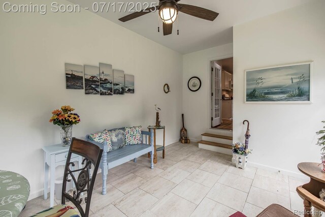 5074 Perryville Rd, Holly, MI 48442 - living area featuring a ceiling fan and baseboards