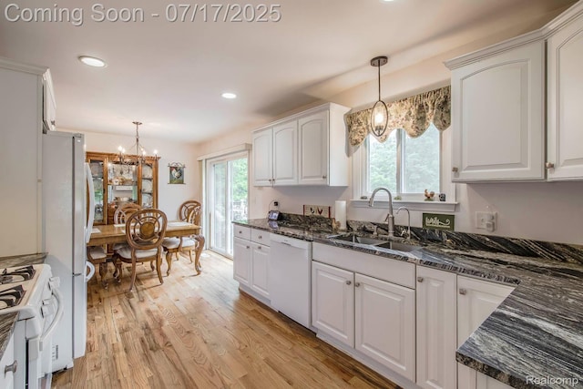 5074 Perryville Rd, Holly, MI 48442 - kitchen with white cabinetry, light wood finished floors, a chandelier, white appliances, and recessed lighting