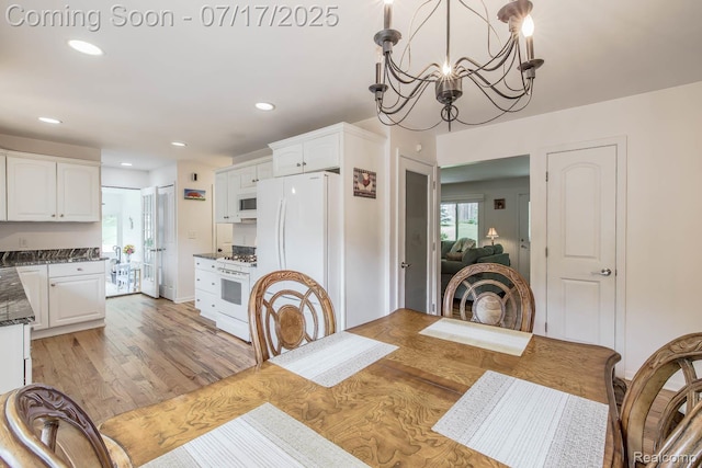 5074 Perryville Rd, Holly, MI 48442 - dining area featuring light wood-style floors, recessed lighting, and a chandelier