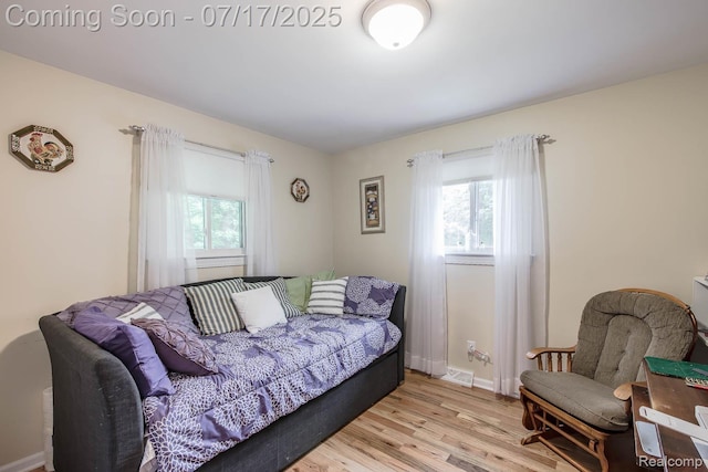 5074 Perryville Rd, Holly, MI 48442 - living area featuring healthy amount of natural light and light wood finished floors