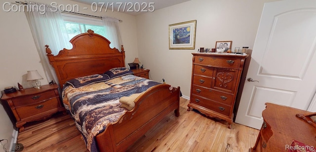 5074 Perryville Rd, Holly, MI 48442 - bedroom with light wood finished floors