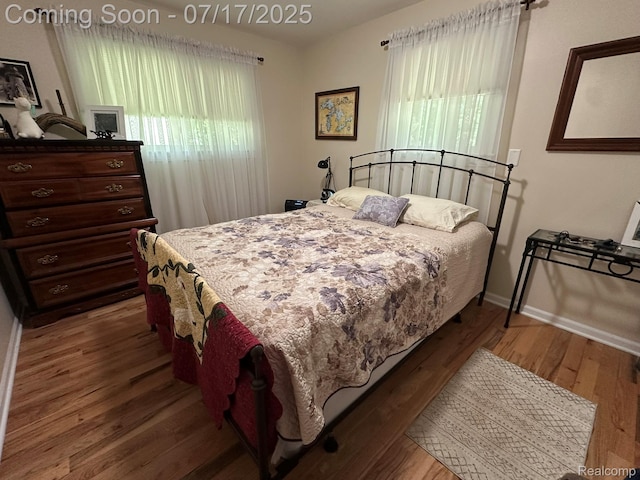 5074 Perryville Rd, Holly, MI 48442 - bedroom with wood finished floors and baseboards