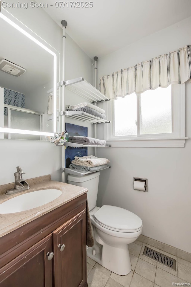 5074 Perryville Rd, Holly, MI 48442 - bathroom featuring vanity, a shower stall, and tile patterned flooring