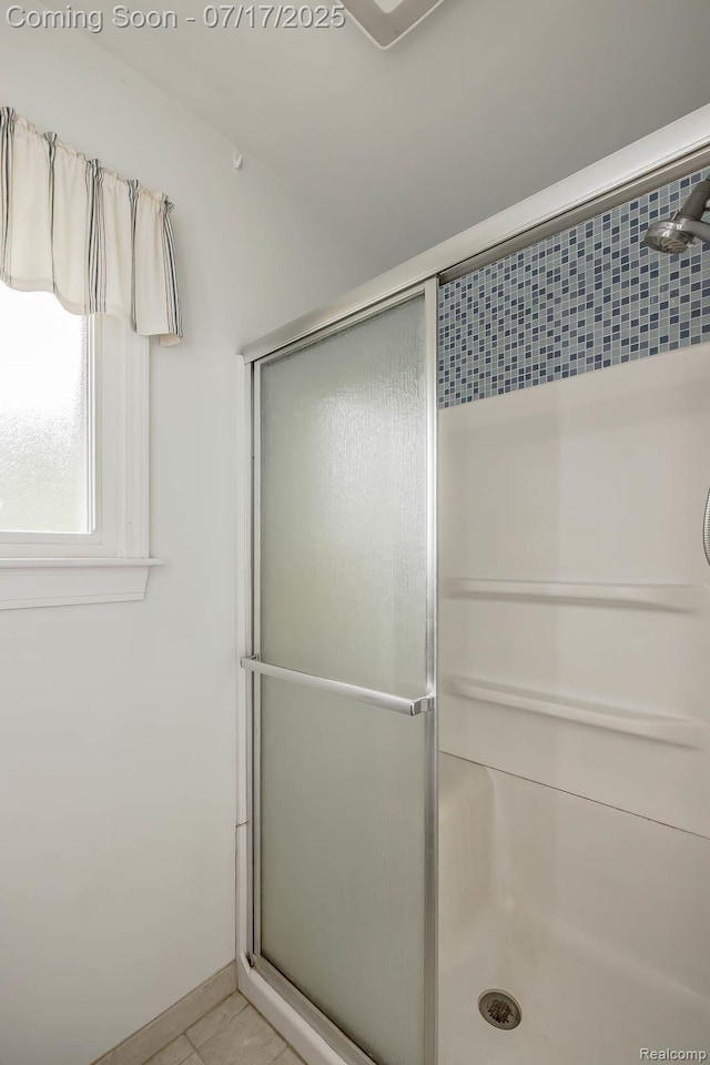 5074 Perryville Rd, Holly, MI 48442 - bathroom featuring a shower stall and tile patterned flooring